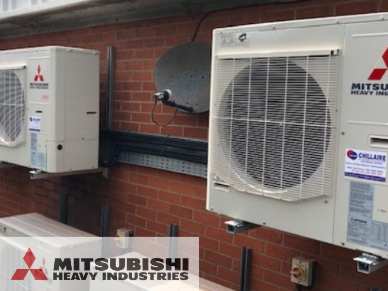 mitsubishi heat pumps mounted to brick wall